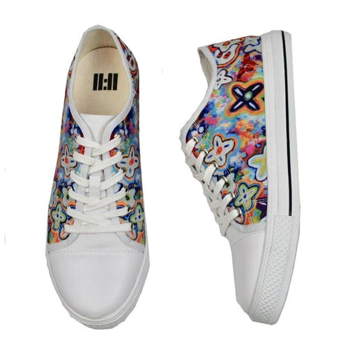 A pair of low-top canvas sneakers shown from the front and side angles on a plain white background. The shoes feature a white rubber toe cap, sole, and laces, while the uppers are covered in a dense, colorful graffiti-style floral pattern with blue, yellow, pink, orange, and green tones.
