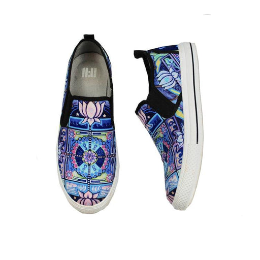 A pair of slip-on canvas sneakers featuring a vibrant blue, purple, and pink mandala pattern on the uppers, black elastic side straps, and white soles, shown from both the top and side views against a plain white background.