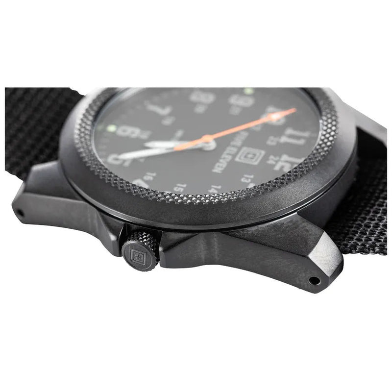 A black watch with a dial on the side on a white background
