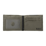 A open black camo wallet with a greenish inside on a white background