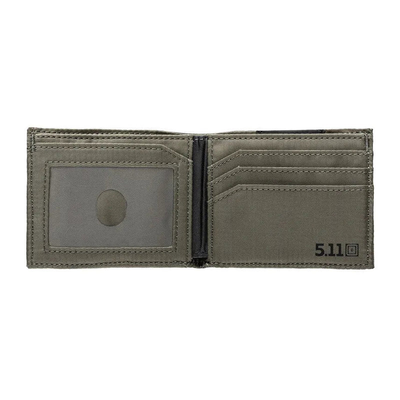 A open black camo wallet with a greenish inside on a white background