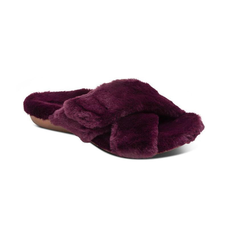 A purple fuzzy sandal slipper on a white background