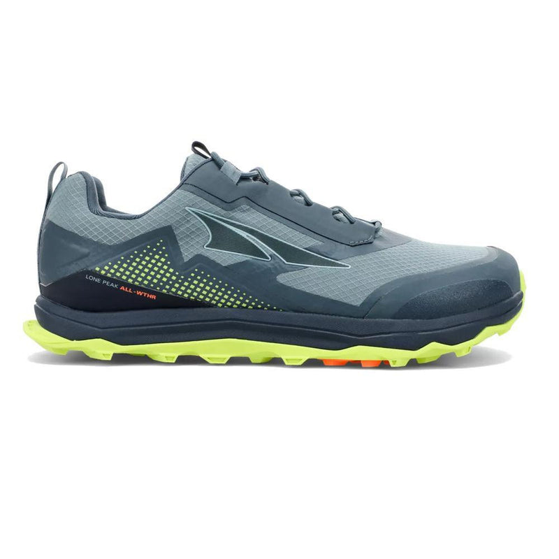 A blue running shoe with a green bottom on a white background