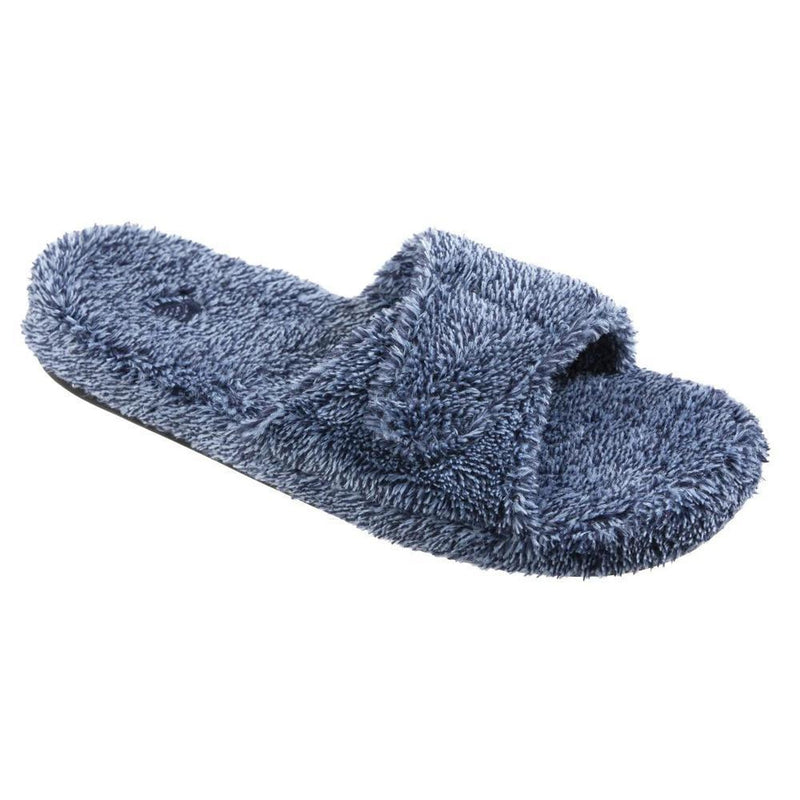 A blue fuzzy slide slipper on a white background