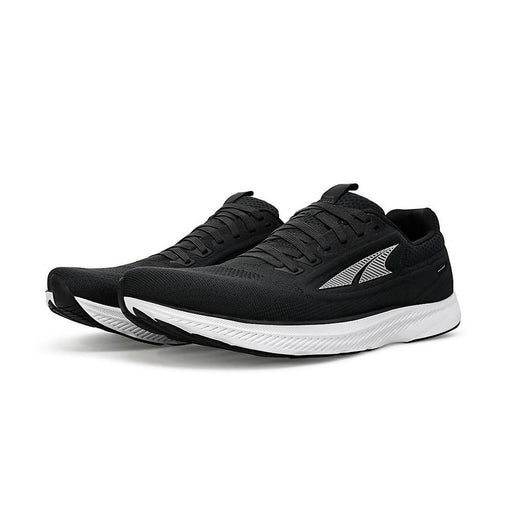 A black running shoe with a white bottom on a white background
