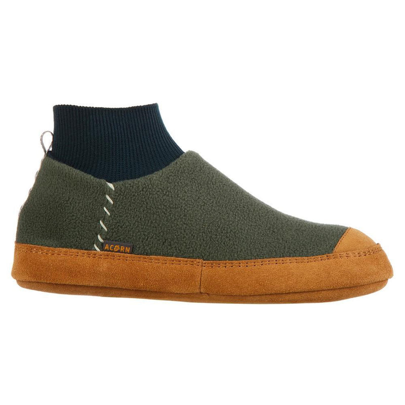 A green and black slipper with a brown bottom on a white background