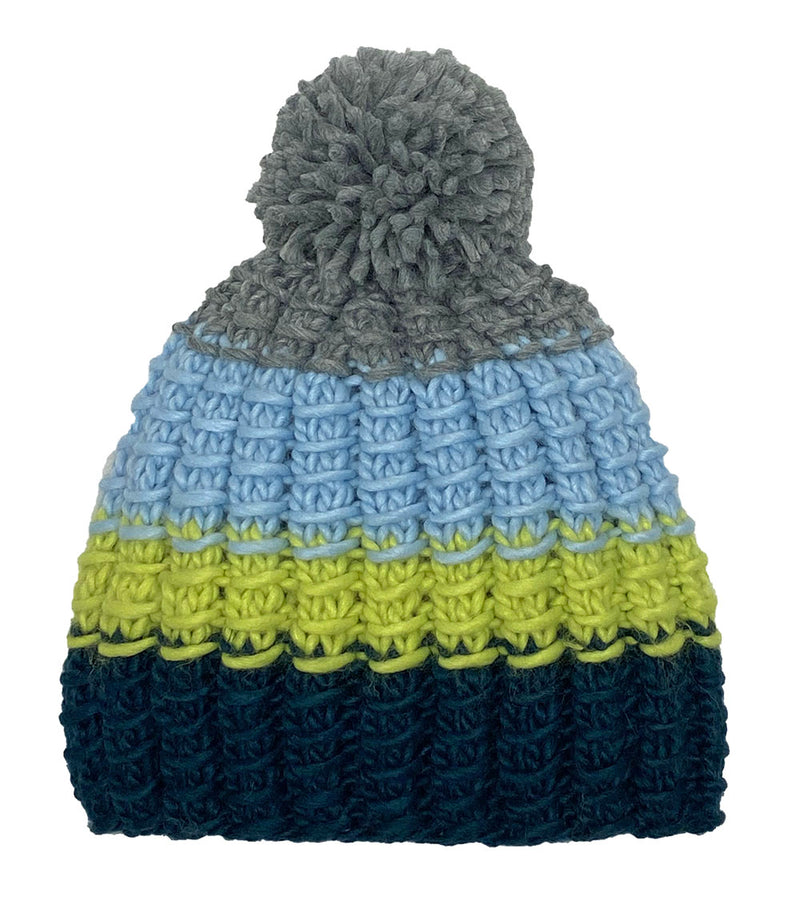 Navy, green, and blue knit pom pom beanie against a white background.