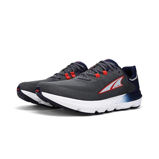 A pair of gray running shoes with white bottoms on a white background