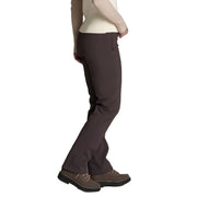 The side of a person wearing a pair of brown pants on a white background