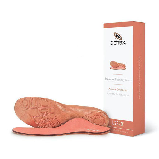 Pair of Aetrex orthotic shoe inserts with packaging on a white background