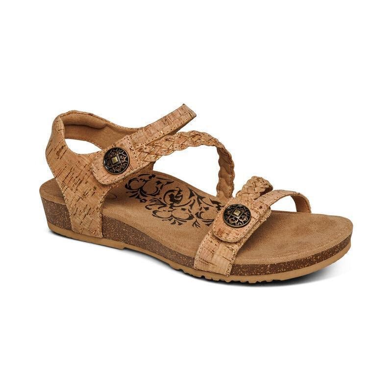 A brown cork sandal on a white background
