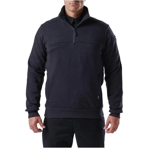 A person wearing a black quarter zip shirt on a white background