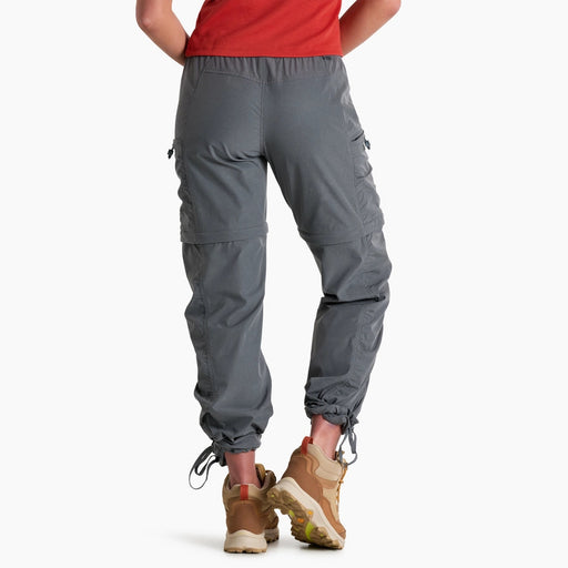 Person wearing gray hiking pants on a white background
