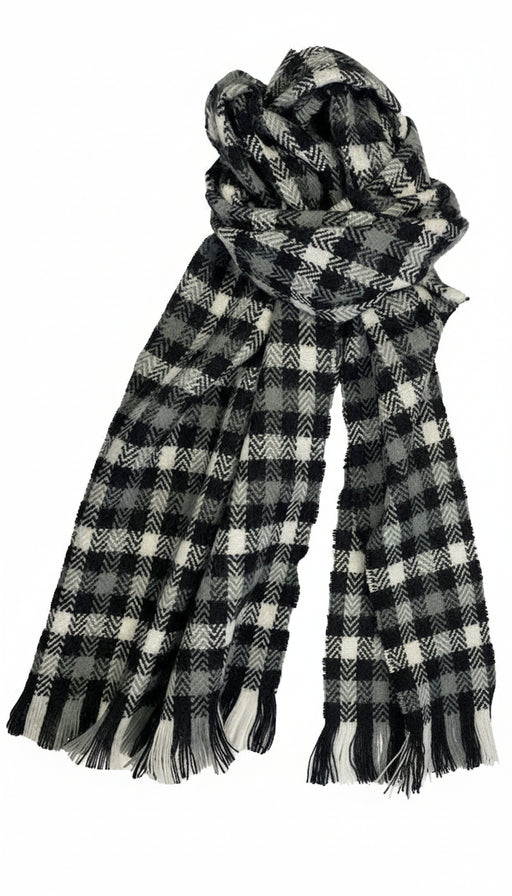 Black and white colored flannel patterned scarf against a white background. 