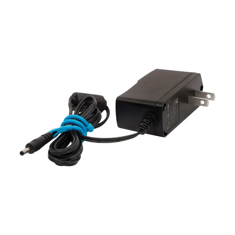 Black power adapter with a coiled cable on a white background