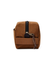Light brown travel bag against a white background. 