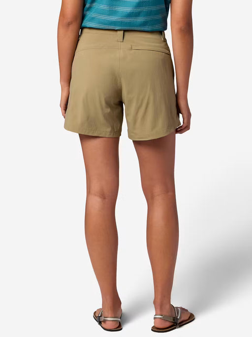 The back of a person wearing tan cargo shorts on a white background