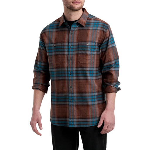 Man wearing a brown and blue plaid shirt on a white background