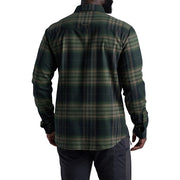 Person wearing a green plaid shirt on a white background