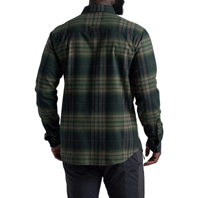 Person wearing a green plaid shirt on a white background