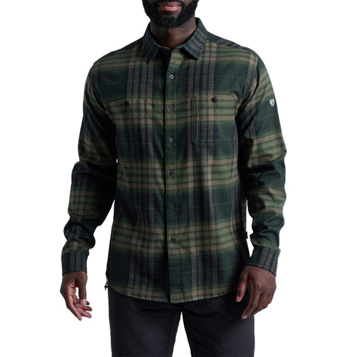 Man wearing a green plaid shirt on a white background