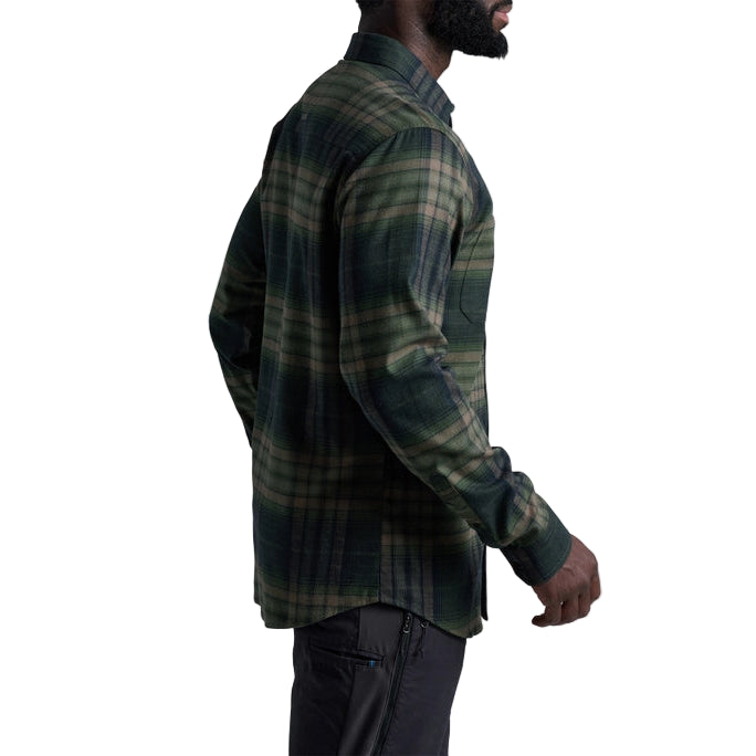 Man wearing a green plaid shirt on a white background