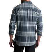 Person wearing a blue and gray plaid shirt on a white background