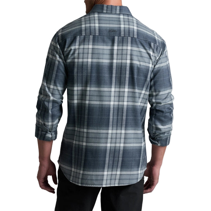Person wearing a blue and gray plaid shirt on a white background