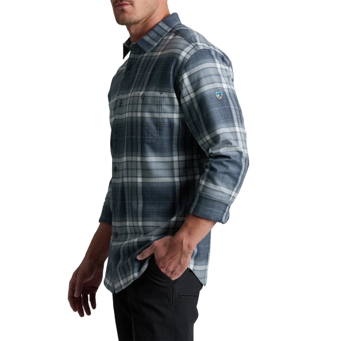 Man wearing a blue plaid shirt on a white background