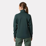 Person wearing a green jacket and pants on a white background