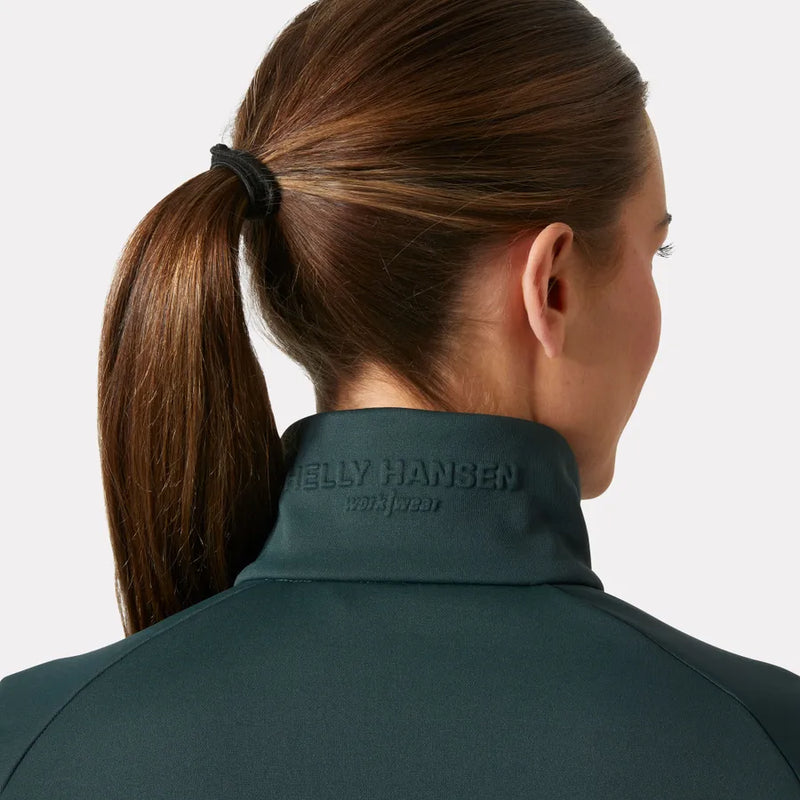 Person wearing a green jacket with 'Helly Hansen' branding on a light gray background