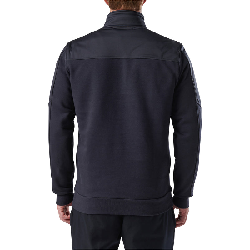 The back of a person wearing a dark navy blue shirt on a white background
