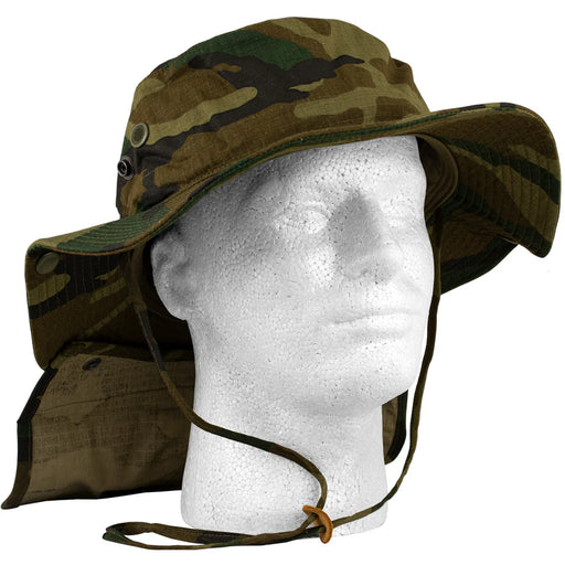 Green camouflage boonie hat on a mannequin against a white background. 