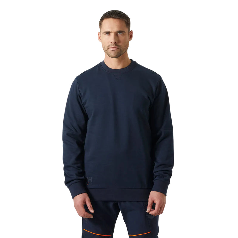 Man wearing a navy blue sweatshirt and pants on a white background