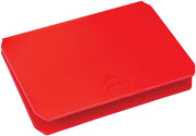 Red rectangular cutting board with a logo on a white background