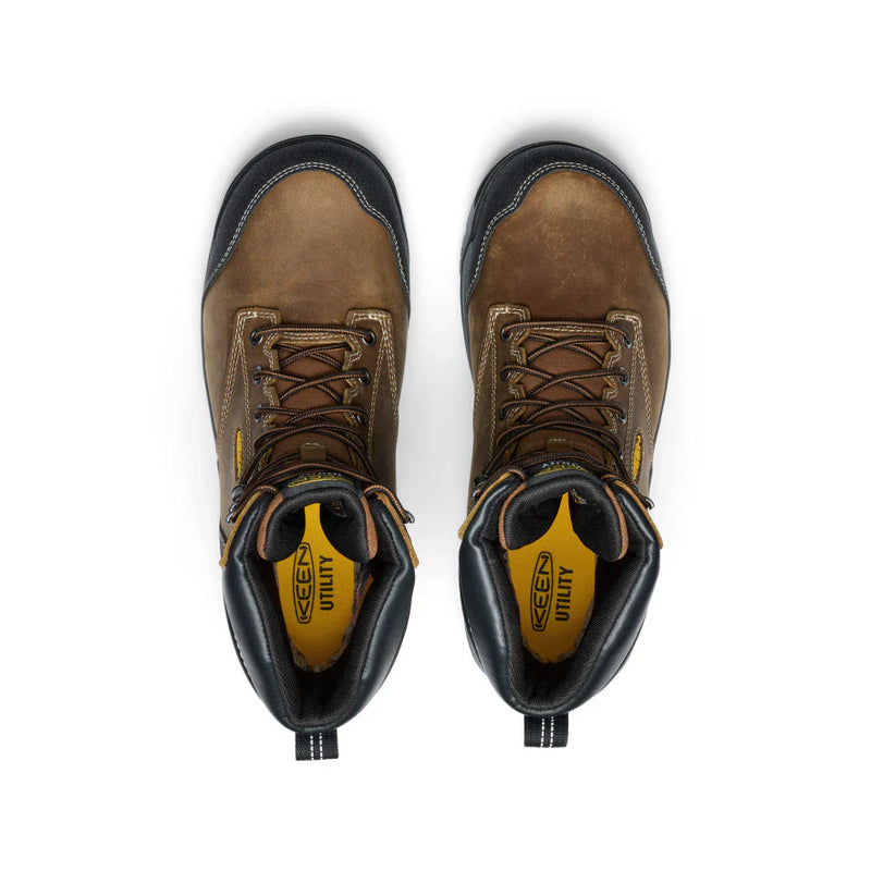 Top view of a pair of brown work boots with yellow accents against a white background. 