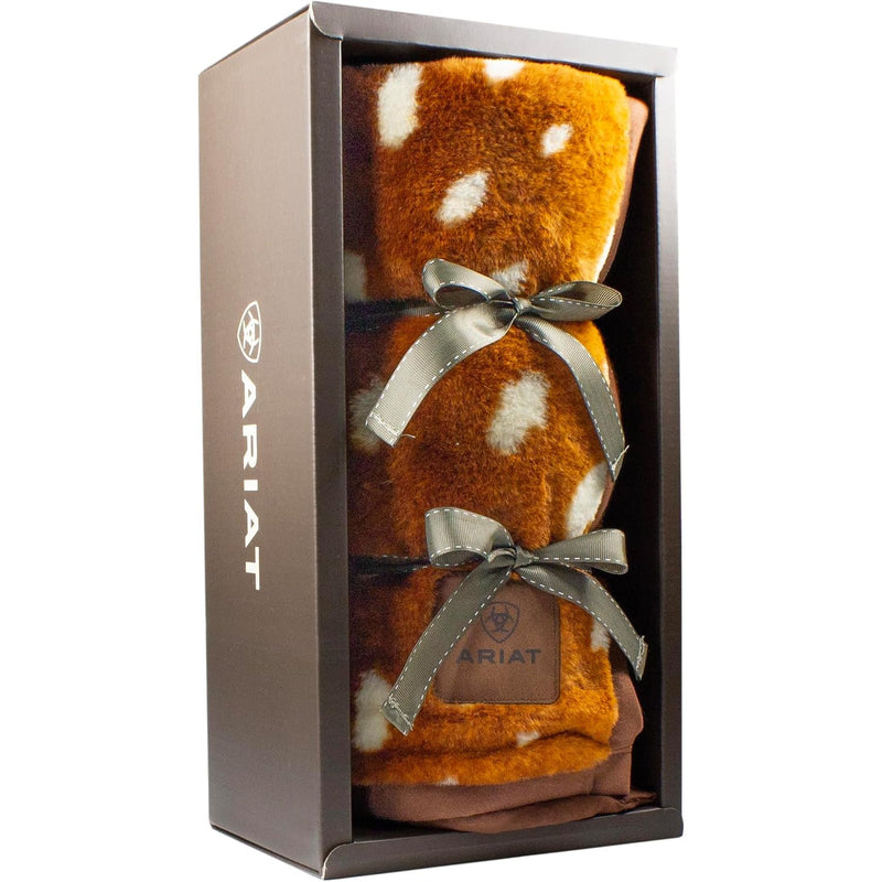 Brown blanket with white polka dots wrapped in a bow in in a case against a white background. 