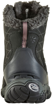 Back view of the spine of a black boot with pink accents against a white background.