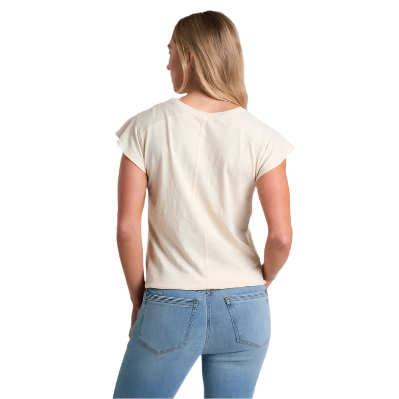 Woman wearing a plain white t-shirt and blue jeans on a white background