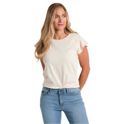Woman wearing a white blouse and blue jeans on a white background