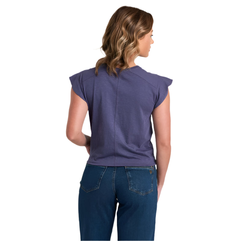 Woman wearing a purple top and blue jeans on a white background
