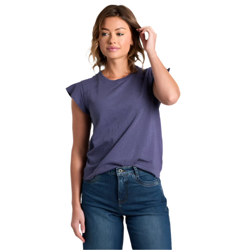 Woman wearing a purple t-shirt and blue jeans on a white background