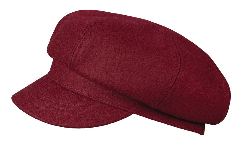Side view of a red cabby cap against a white background. 