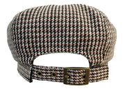 Back view of a black and white houndstooth pattern cabby cap against a white background. 