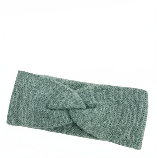 Teal colored headband against a white background. 