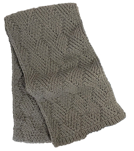 Grey knit scarf against a white background. 