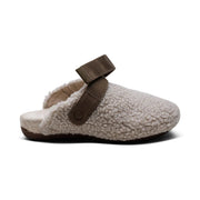 Fur slipper with brown strap on a white background.