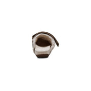 Back view of a fur sandal with brown strap on a white background.