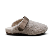 Fur slipper with brown strap on a white background.
