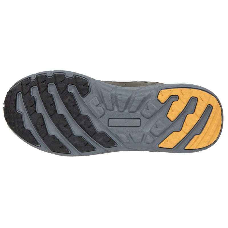 Close-up of a shoe sole with gray and yellow pattern on a white background